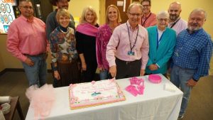 Cake cutting to celebrate new diagnostic equipment